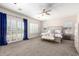 Main bedroom with plush carpet and access to a patio at 3799 S Skyline Dr, Gilbert, AZ 85297
