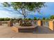 Tranquil lake view with a stone seating area at 3799 S Skyline Dr, Gilbert, AZ 85297