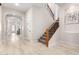 Bright entryway with wood staircase and tile flooring at 3799 S Skyline Dr, Gilbert, AZ 85297