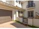 View of the garage and side entrance with a gate at 3799 S Skyline Dr, Gilbert, AZ 85297