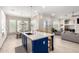Spacious kitchen with a large island, white cabinets and a view into the Gathering room at 3799 S Skyline Dr, Gilbert, AZ 85297