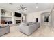 Living room with sectional sofa, fireplace and view down hallway at 3799 S Skyline Dr, Gilbert, AZ 85297