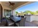 Covered patio features dining table and access to backyard oasis at 3799 S Skyline Dr, Gilbert, AZ 85297