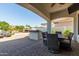 Outdoor patio with seating area, built-in grill, and pool access at 3799 S Skyline Dr, Gilbert, AZ 85297