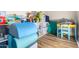 play area with toys, a small table, and storage shelves at 3799 S Skyline Dr, Gilbert, AZ 85297