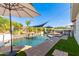 Inviting pool area with waterfall feature and shaded seating at 3799 S Skyline Dr, Gilbert, AZ 85297