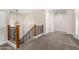 Upstairs hallway with wood railing and carpeted flooring at 3799 S Skyline Dr, Gilbert, AZ 85297