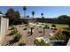 Desert Landscaping in backyard featuring gravel, yucca, barrel cactus and desert wildflowers at 2057 E Howe Ave, Tempe, AZ 85281