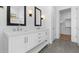A bright bathroom with dual sinks, stylish mirrors, and sleek countertops at 4353 N 203Rd Ave, Buckeye, AZ 85396