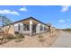 A modern home featuring desert landscaping at 4353 N 203Rd Ave, Buckeye, AZ 85396
