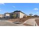 This modern single-Gathering home boasts low-maintenance desert landscaping and sleek architectural design at 4353 N 203Rd Ave, Buckeye, AZ 85396