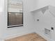 An efficient laundry room with modern shelving and storage at 4353 N 203Rd Ave, Buckeye, AZ 85396