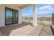 The open patio presents an expansive space for outdoor enjoyment, blending indoor comfort with the beauty of the backyard landscape at 4353 N 203Rd Ave, Buckeye, AZ 85396