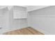 A walk-in closet featuring custom shelving and ample storage space at 4353 N 203Rd Ave, Buckeye, AZ 85396