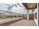 Outdoor patio and a black iron fence overlooking desert landscaping at 4359 N 203Rd Ave, Buckeye, AZ 85396