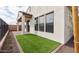 This backyard features an artificial lawn, providing low-maintenance greenery and comfort at 4359 N 203Rd Ave, Buckeye, AZ 85396