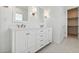 Bathroom with a double vanity sink and storage cabinets at 4359 N 203Rd Ave, Buckeye, AZ 85396