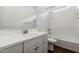 Clean bathroom featuring a white vanity, shower-tub combo, and subway tile backsplash at 4359 N 203Rd Ave, Buckeye, AZ 85396