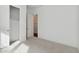 Light-filled bedroom with neutral carpet and large closet at 4359 N 203Rd Ave, Buckeye, AZ 85396