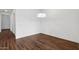 Dining room area with hardwood-look tile flooring and contemporary lighting fixture at 4359 N 203Rd Ave, Buckeye, AZ 85396