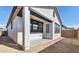 Exterior view of home with a small patio area and minimal landscaping at 20311 W Montecito Ave, Buckeye, AZ 85396