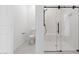 A well-lit bathroom features a walk-in shower with sleek fixtures and a modern toilet at 20311 W Montecito Ave, Buckeye, AZ 85396