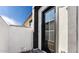 Exterior doorway featuring glass door and white and black facade at 20311 W Montecito Ave, Buckeye, AZ 85396