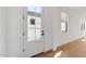 Bright entryway featuring wood floors and natural light at 20311 W Montecito Ave, Buckeye, AZ 85396