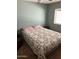 Modest bedroom with a patterned quilt on the bed, offering a comfortable resting space at 3330 E Main St # 440, Mesa, AZ 85213