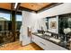 Modern bathroom with double sinks and a walk-in shower at 9556 E Celestial Dr, Scottsdale, AZ 85262
