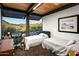 Guest bedroom with two twin beds and a workspace at 9556 E Celestial Dr, Scottsdale, AZ 85262