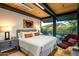 Main bedroom with mountain views and wood floors at 9556 E Celestial Dr, Scottsdale, AZ 85262