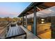 Deck with table and chairs, offering views into the home at 9556 E Celestial Dr, Scottsdale, AZ 85262
