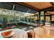 Modern dining area with a marble table and views of a courtyard at 9556 E Celestial Dr, Scottsdale, AZ 85262