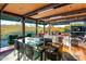 Open concept dining room with glass table and mountain views at 9556 E Celestial Dr, Scottsdale, AZ 85262