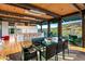Open dining room with glass table and mountain views at 9556 E Celestial Dr, Scottsdale, AZ 85262