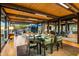 Open dining area with glass table and mountain views at 9556 E Celestial Dr, Scottsdale, AZ 85262