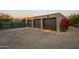 Three-car garage with paver driveway at 9556 E Celestial Dr, Scottsdale, AZ 85262