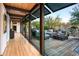 Long hallway with glass walls and views of the backyard at 9556 E Celestial Dr, Scottsdale, AZ 85262