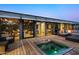 Deck with hot tub and seating area, modern home in background at 9556 E Celestial Dr, Scottsdale, AZ 85262