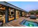 Deck with hot tub and seating area offering stunning views at 9556 E Celestial Dr, Scottsdale, AZ 85262