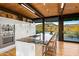 Modern kitchen with island, stainless steel appliances, and mountain views at 9556 E Celestial Dr, Scottsdale, AZ 85262