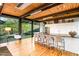 Modern kitchen with island and breakfast bar, offering mountain views at 9556 E Celestial Dr, Scottsdale, AZ 85262