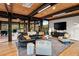 Bright living room featuring hardwood floors, modern furniture, and a large TV at 9556 E Celestial Dr, Scottsdale, AZ 85262