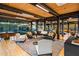 Expansive living room with hardwood floors, a glass wall, and stylish seating at 9556 E Celestial Dr, Scottsdale, AZ 85262