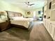 Main bedroom with king-size bed and built-in shelving at 895 W Tyson St, Chandler, AZ 85225