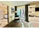 Bright bedroom with built-in shelving and access to patio at 895 W Tyson St, Chandler, AZ 85225