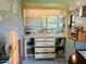 China cabinet boasts glass shelving, drawers, and cabinets for storing tableware and serving dishes at 895 W Tyson St, Chandler, AZ 85225