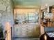 Elegant dining room with a built-in china cabinet featuring glass shelves and drawers for storing tableware at 895 W Tyson St, Chandler, AZ 85225