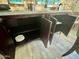 Open dining room buffet reveals ample storage space within the dark wood cabinets at 895 W Tyson St, Chandler, AZ 85225